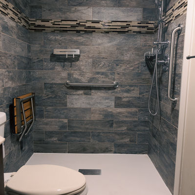 Modern tiled shower with grab bar, yuma