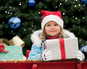 Little Girl with Christmas Present