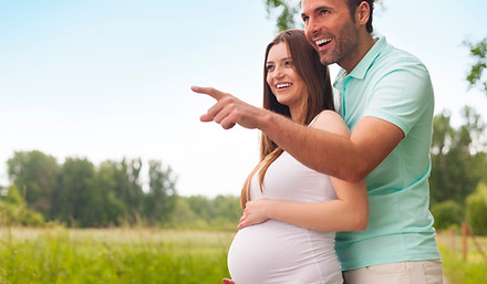 happy-excited-couple-pregnant-looking-away.jpg