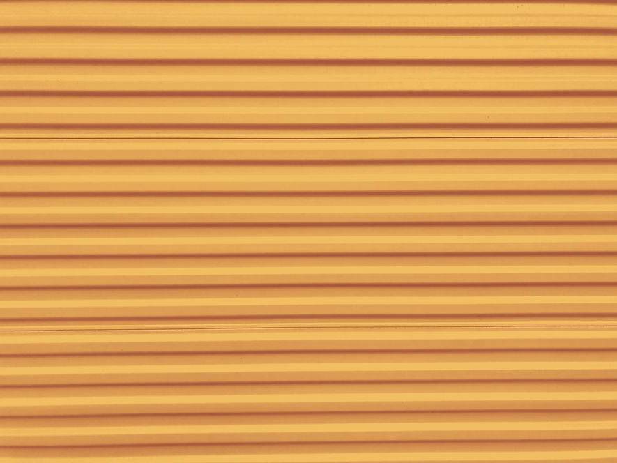 Orange Self Storage Unit Corrugated Metal Background_edited_edited.jpg