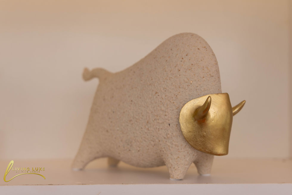 Elegant gold-horned cow sculpture