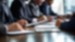 close-up-business-people-hands-working-with-documents-meeting-table_795422-6962.jpg