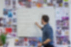 Picture of a person writing on the board