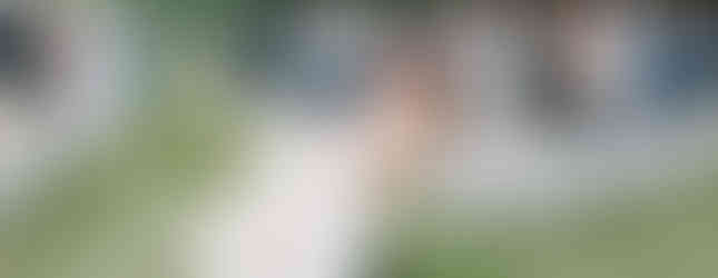 Bride and groom dip after wedding ceremony in Michigan