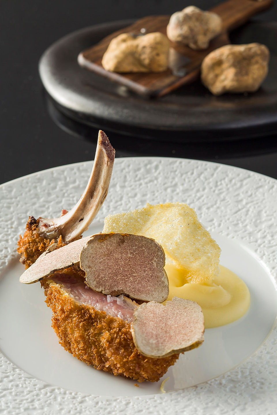 Veal_chop_“Cotoletta”_cooked_medium_rare,_coarse_mash_potatoes_and_Alba_...