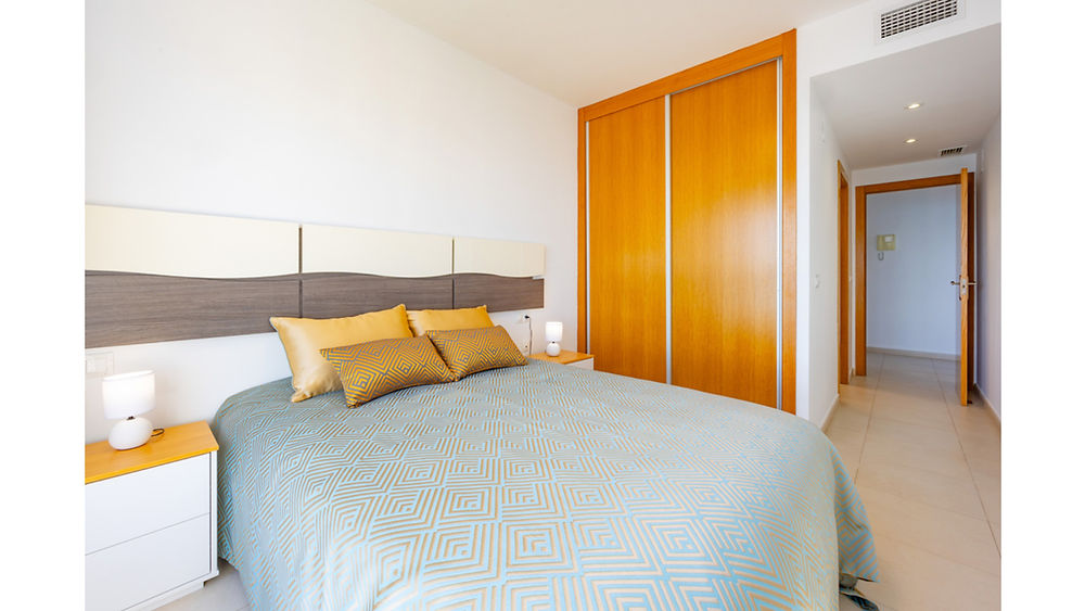 Bedroom in a 2 bedroom apartment Calpe with wooden closet.