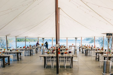 Dining table setup at Penobscot Bay Estate, Tented Waterfront Wedding Venue, Judi Michalik Photography