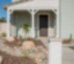 Dry stream bed in a waterwise, drought tolerant residential landscape.