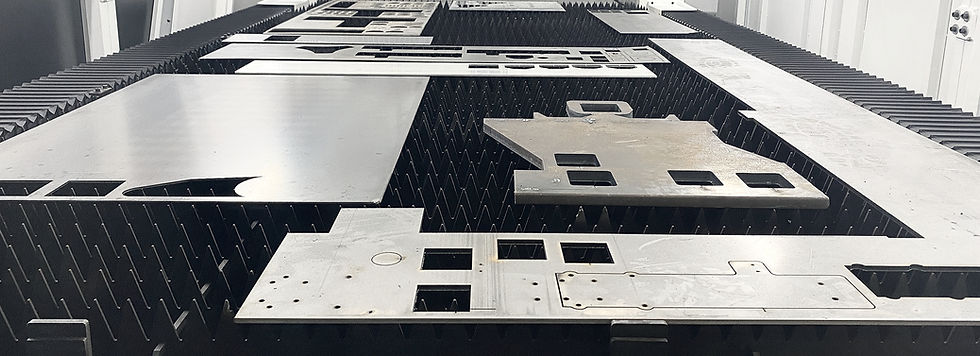 Sheets of metal on an advanced laser cutting machine bed