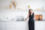 Helen Barnes standing in minimalist kitchen