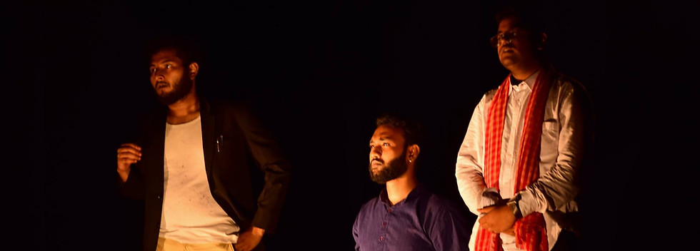 An actor is bound to the chair by two others as he was unwilling to co-operate with them in running the course of a play