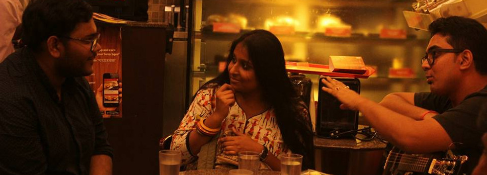 Three friends talking passionately about their future in CCD Cafe in the play Curtain Call, an Intimate theatre by Bodnaam.