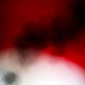 Abstraktes Bild einer rauchartigen Wolke auf buntem Hintergrund.