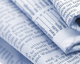 Close-up of a pile of folded newspapers