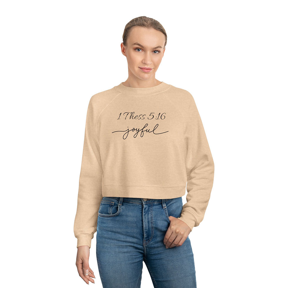 Woman in a tan sweatshirt with Choose to be Joyful text
