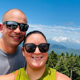 couple overlooking mountains from top of clingman's dome in smoky mountains national park