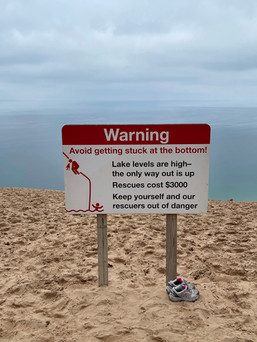 red warning sign sleeping bear dunes national park m-22 traverse city michigan