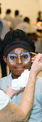 Face painting at a Brooklyn Lab creative day