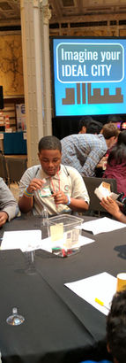 Brooklyn Lab students with a black teacher at tech event.