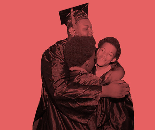 Brooklyn Lab teacher hugs new graduates