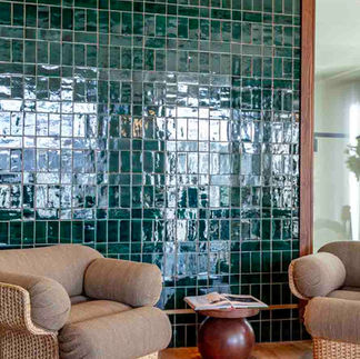 Tilers in London completing elegant bathroom tiles at Mason & Fifth Hotel