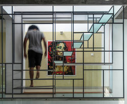 Climbing down the staircase to the terrace to the passage below