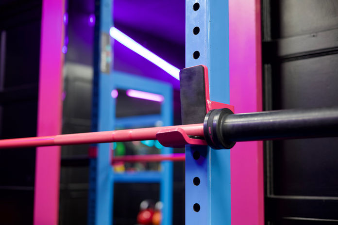 A bar on a squat rack
