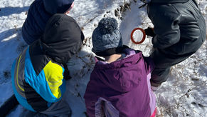 Kids exploring in snow.