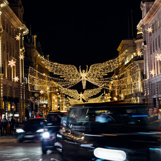 Bright angel lights lining Regent Street in Piccadilly Circus, London