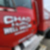 Chad Malley Well Drilling company truck in red, featuring the logo and US DOT number 1864959 on the door, parked at a job site in Rosebush, MI.
