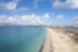 Birds eye view of Agios Prokopios beach with turquoise waters and golden sand