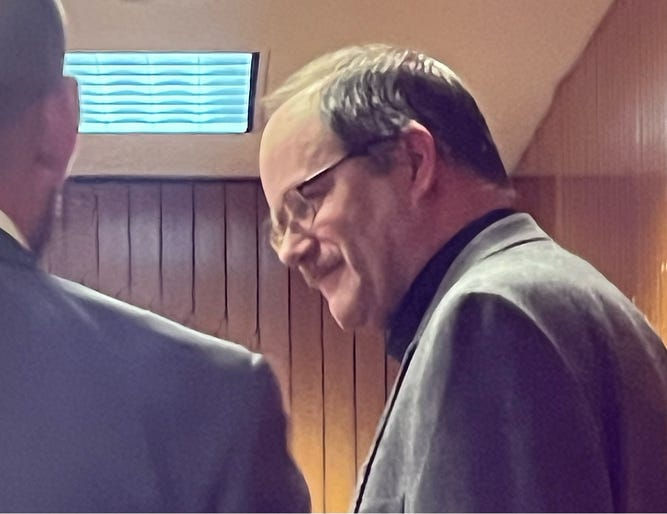 Dale Warner moments before viewing his wife's autopsy pics. Photo by Tracy Stengel.