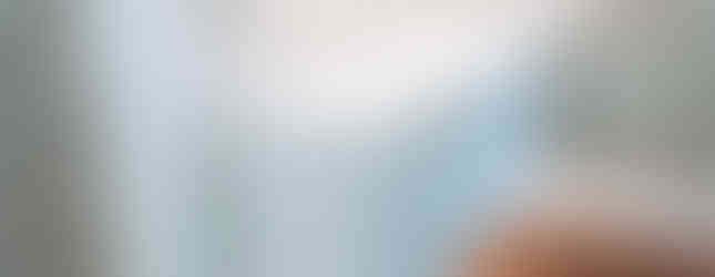 Custom lighting throughout dining room cabinets with hardwood floors and cherry blossom wallpaper