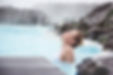 Woman enjoying natural spa, Blue Lagoon is a geothermal spa in southwestern Iceland, is lo