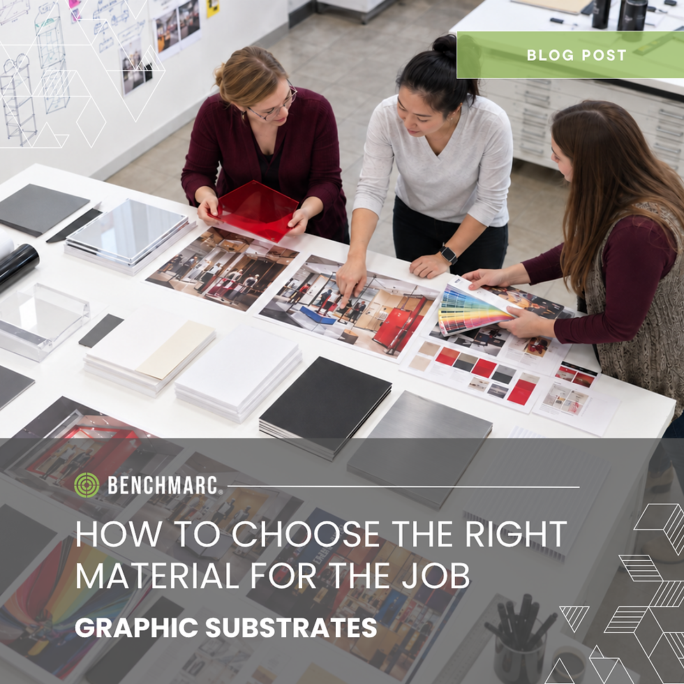 Overhead view of retail display designers reviewing graphic substrate samples, color swatches, retail display concepts and material options for a custom point-of-purchase display project.
