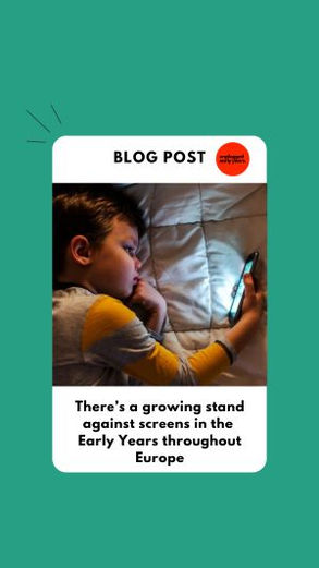 A young child staring at a screen