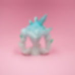 3D printed ice elemental miniature with crystal spikes on a pink background, rear view.