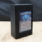 Slim deck box standing upright on wooden surface