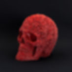 Sparkle red skull decoration with detailed rose pattern on the surface.