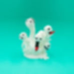 3D printed white false hydra model with multiple heads and red tongues on a teal background.