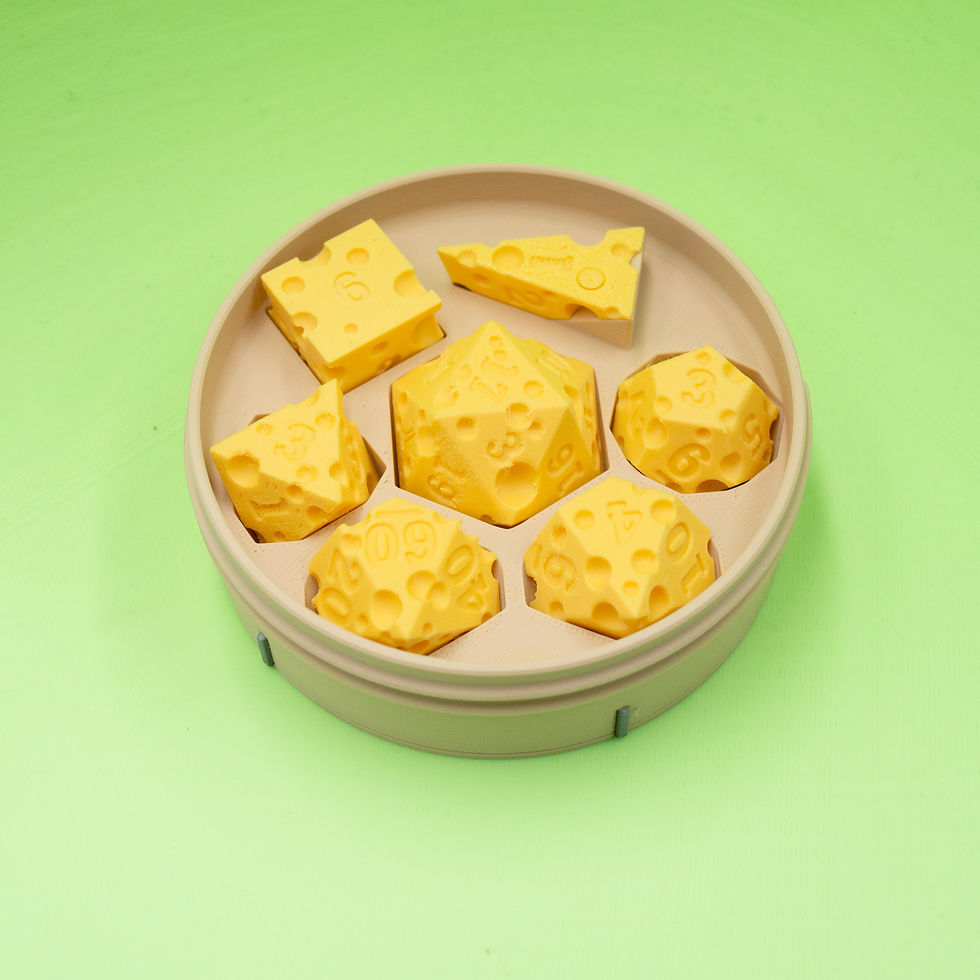 Open dice box showing yellow Swiss cheese style polyhedral dice.