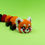 Thumbnail: Close-up of a 3D printed red panda flexi model on a green background.