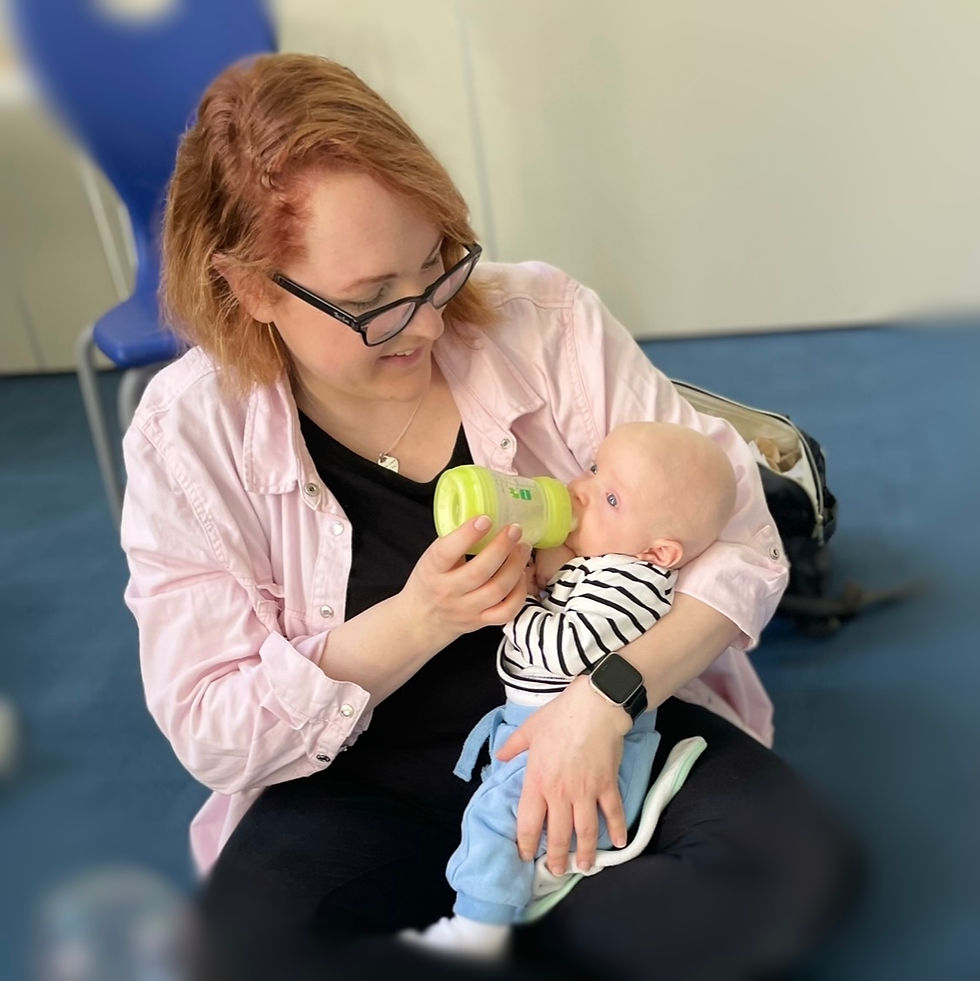 Mother and baby bonding over feeding at Happy Little Signers baby signing class (Middlewich and Sandbach)