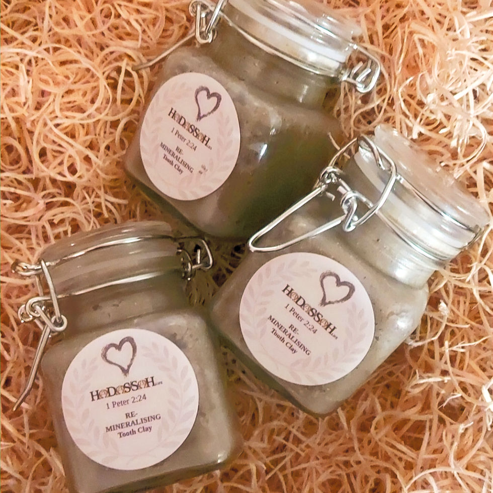 Thumbnail: Pots of re-mineralising tooth clay on a bed of wood shavings