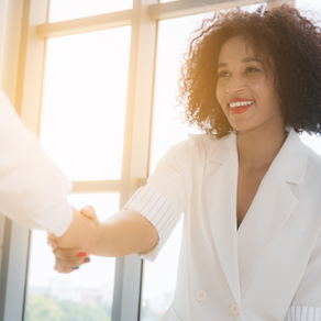 Woman looking confident and shaking hands