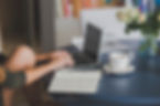 Simply Said Creative woman with a coffee notebook and  laptop