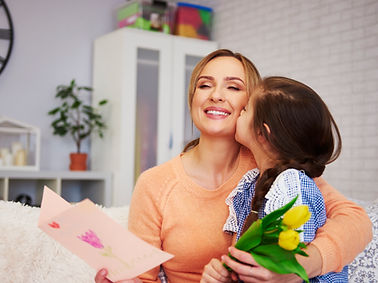 shot-of-child-kissing-her-mommy-on-the-cheek.jpg