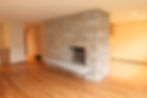 Living room remodel in Loyal Heights, Seattle featuring refurbishment of a Wilkinson Stone fireplace and sandstone hearth.