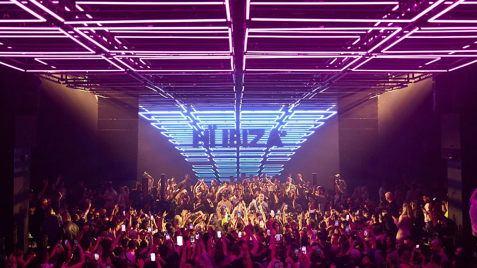 Neon laser-grid ceiling inside an Ibiza superclub at night