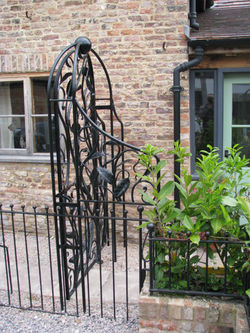 Forged leaf garden gate side